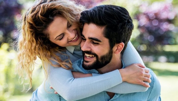 Young woman hugging partner from behind 768